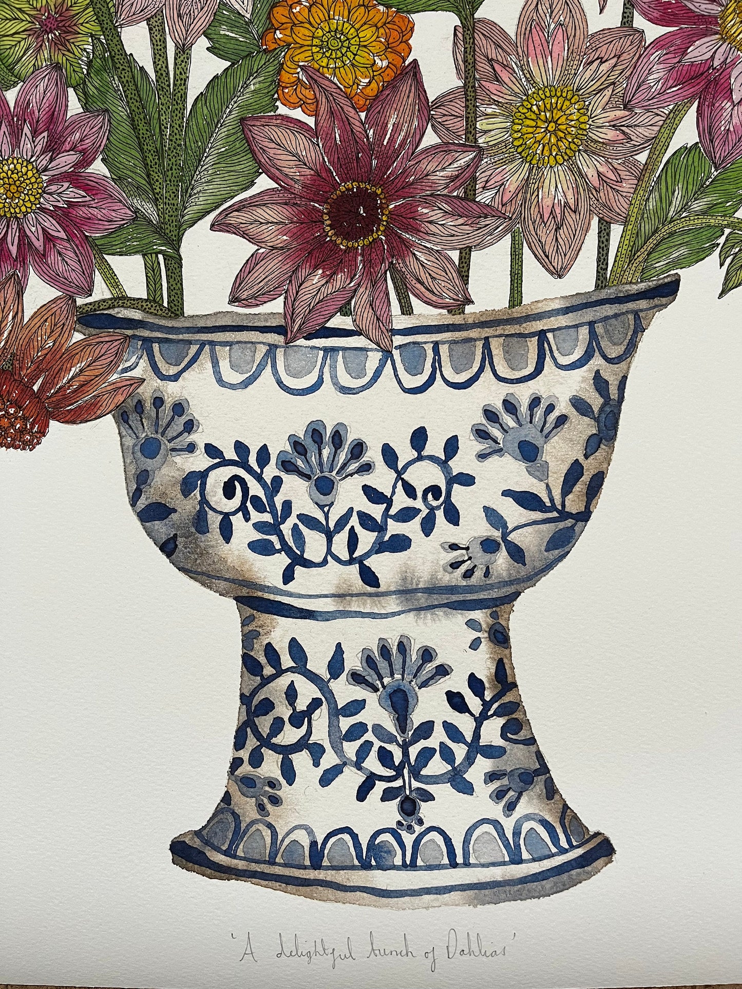 A3 limited edition, giclee print of cheerful dahlias in a blue and white patterned, ceramic vessel.
